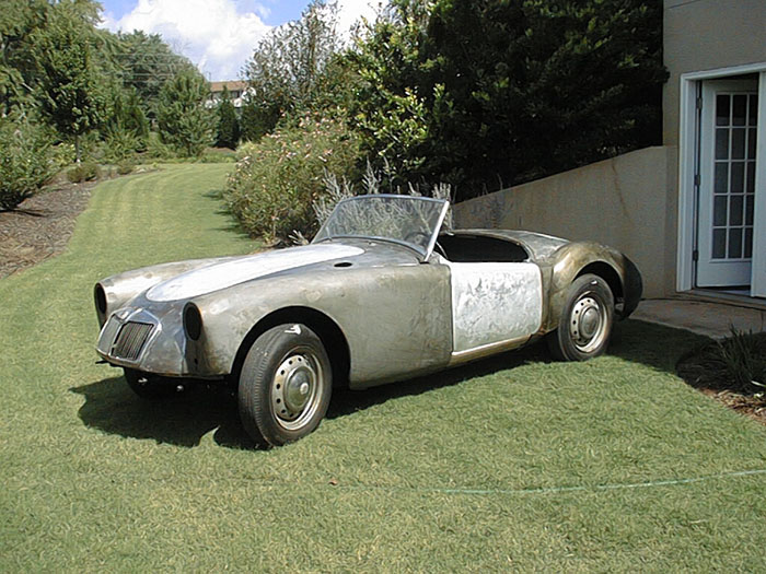 1960 MG MGA 1600 restoration project. Frame-off restoration of classic car, rebuild of 1960 MGA 1600. Bare sheetmetal 1960 MGA 1600 aluminum body panels. 1960 MG MGA 1600 Convertible. Classic British sports car by MG, the 1960 MGA Convertible. MG 1960 MGA 1600 Convertible by British car company MG