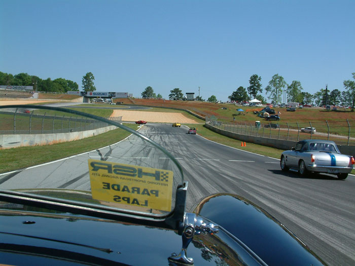 1960 MG MGA 1600 Convertible on race track Road Atlanta for Walter Mitty HSR race. 1960 MGA 1600 Historic Sportscar Racing Road Atlanta Walter Mitty. Classic British sports car by MG, the 1960 MGA Convertible in Blue. A Blue 1960 MGA 1600 Convertible by British car company MG